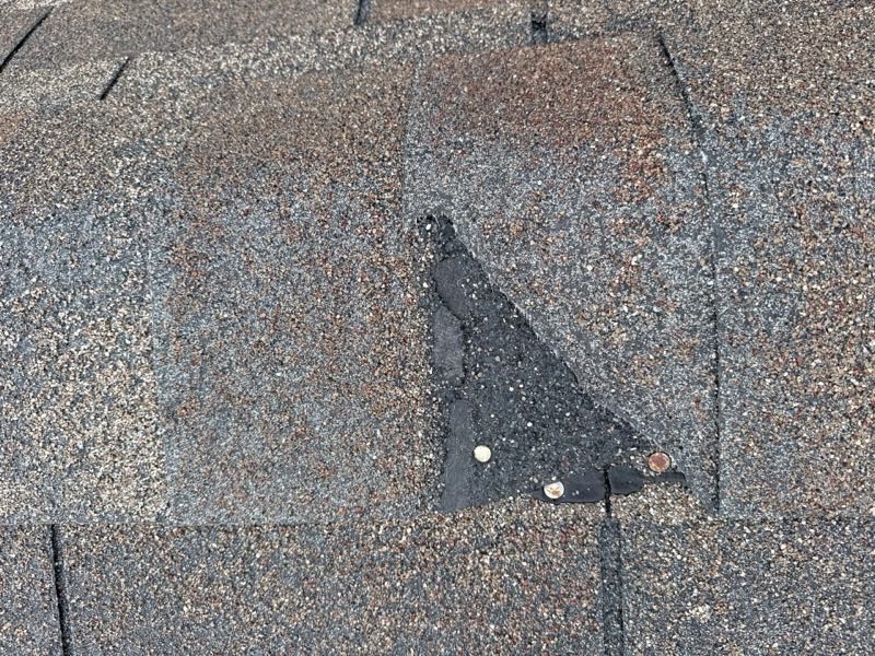 Missing shingle with the fasteners left exposed