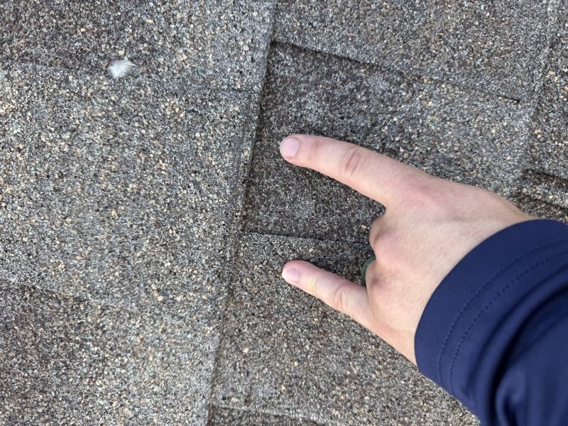 Close inspection of an impact mark on a shingle