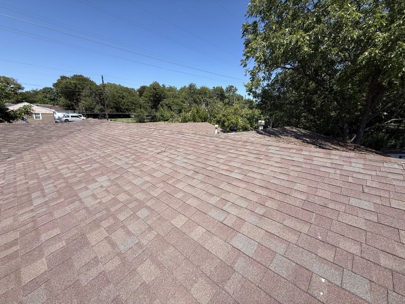 Wide slope on a weathered shingle roof